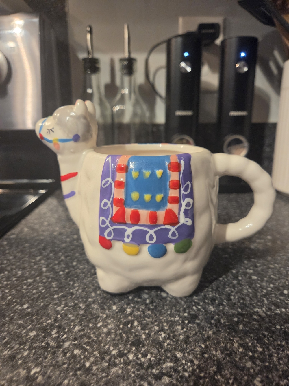 White Ceramic Llama Mug with Colorful Saddle